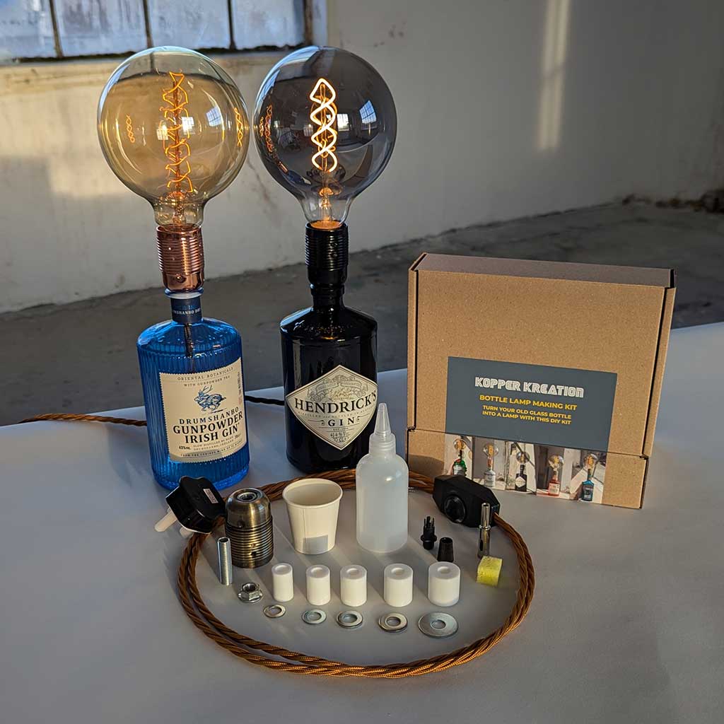 Bottle lamp making set with Hendrick's and Gunpowder gin bottles, light bulbs, and tools