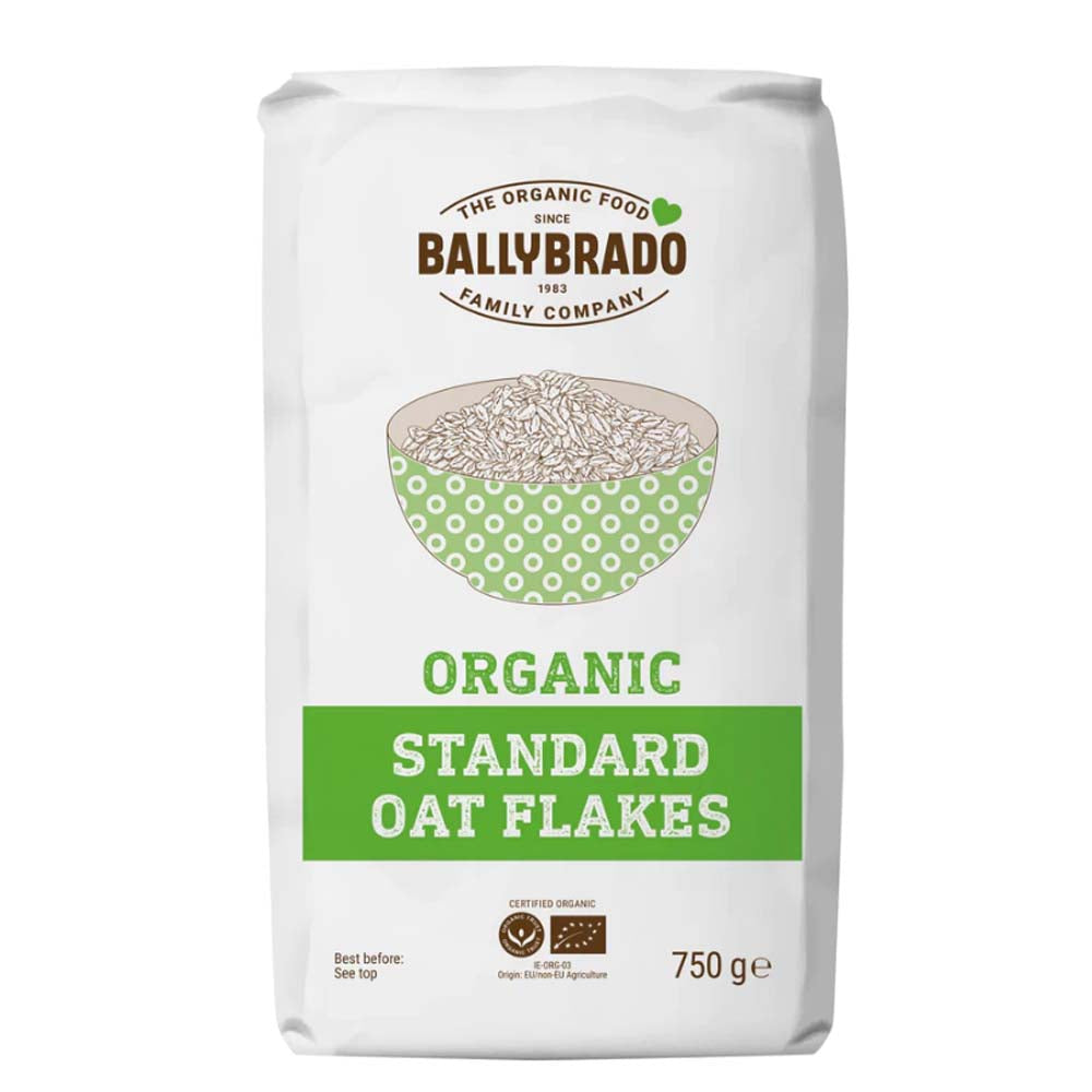 A 750 g white bag of Ballybrado Organic Standard Oat Flakes, featuring a green and brown logo and a bowl illustration on the front.