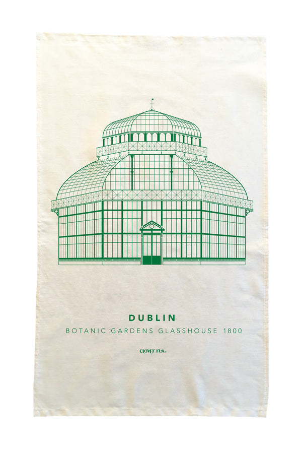 Tea towel with green botanical garden glasshouse design on a white background