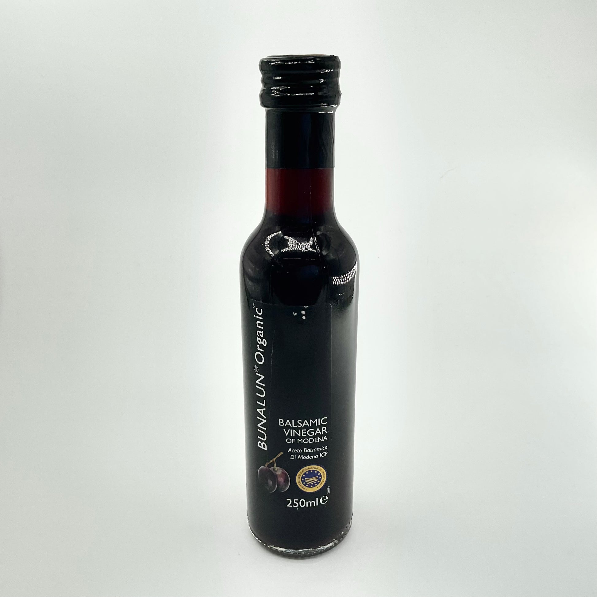 A bottle of Bunalun Organic Balsamic Vinegar of Modena, 250ml size, with labels indicating its organic certification and origin.