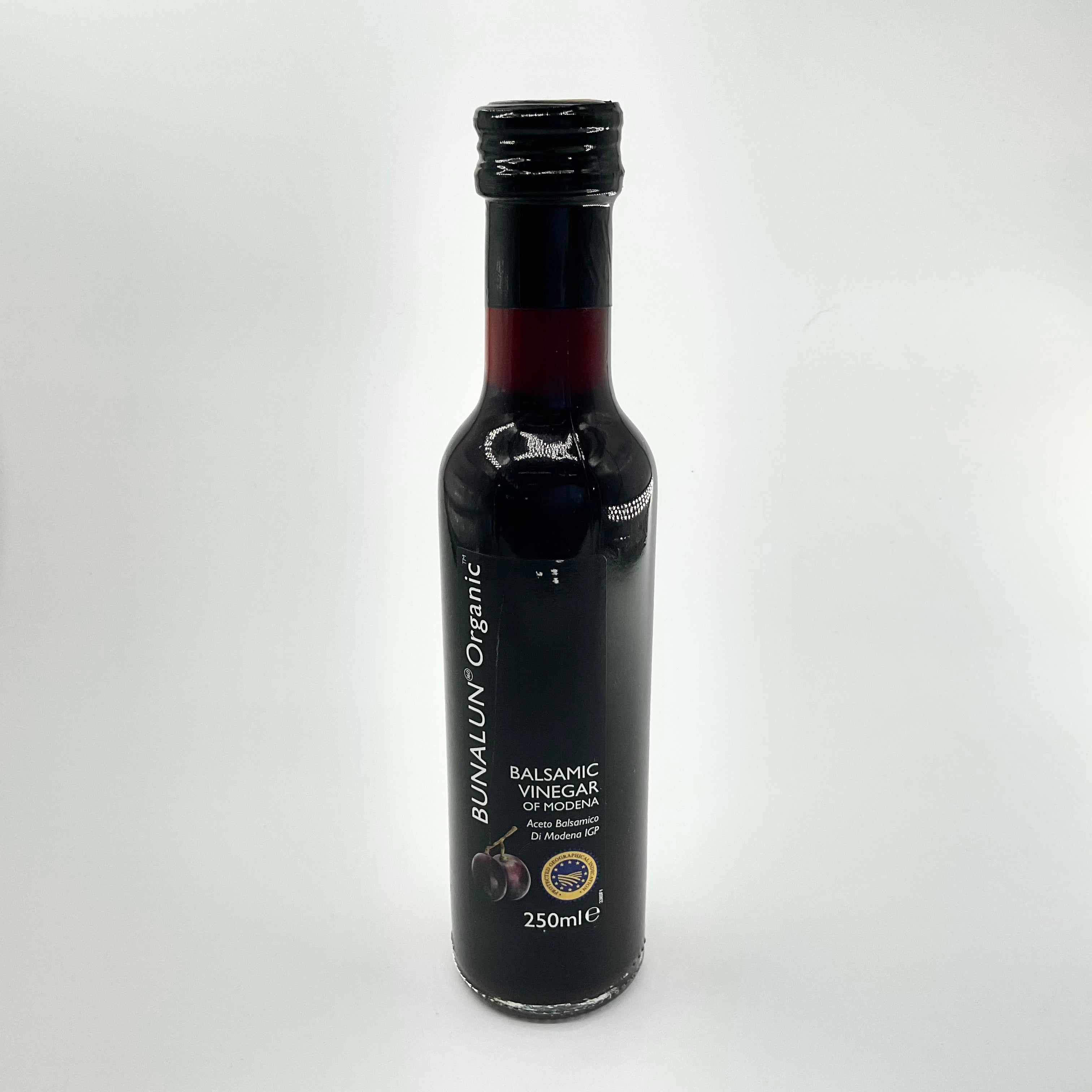 A bottle of Bunalun Organic Balsamic Vinegar of Modena, 250ml size, with labels indicating its organic certification and origin.