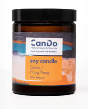 Candle jar with 'CanDo' label on a white background