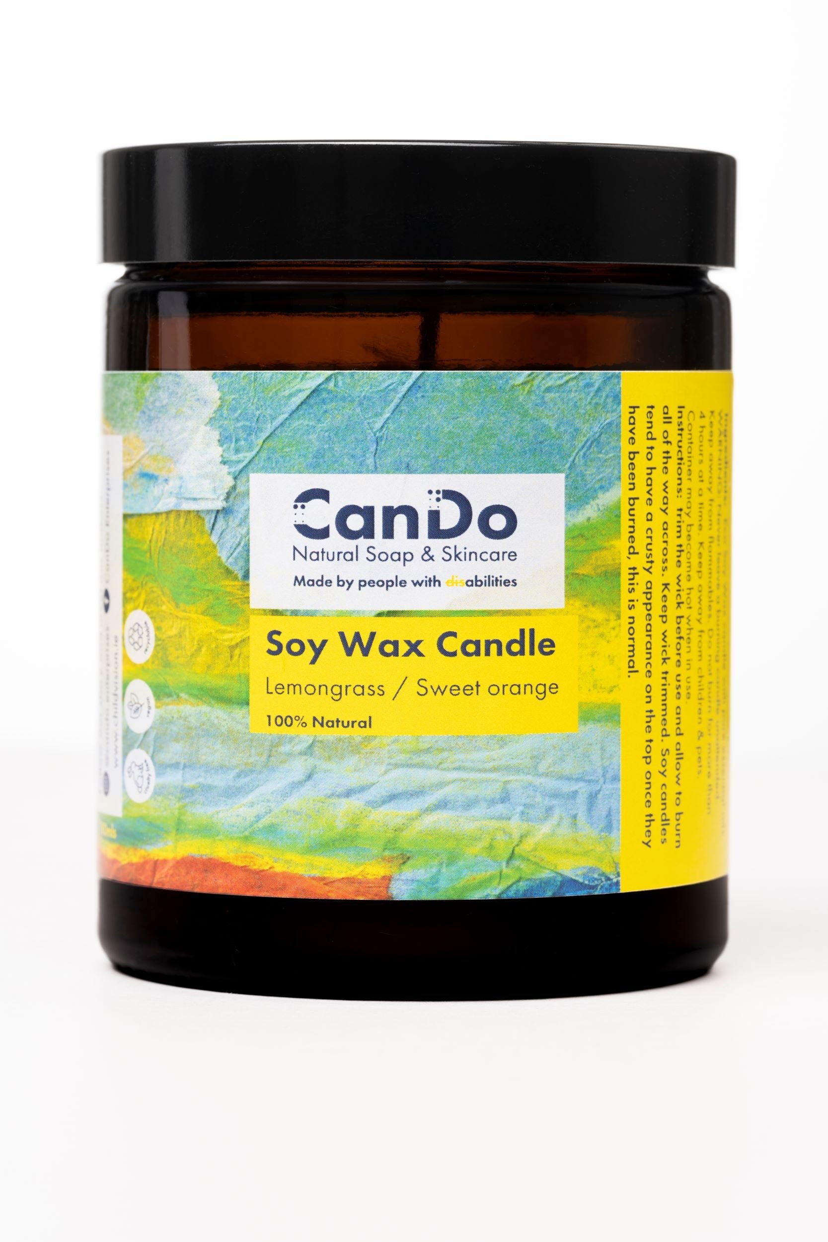 Soy wax candle with a colorful label on a white background