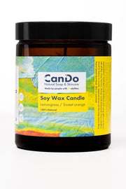 Soy wax candle with a colorful label on a white background