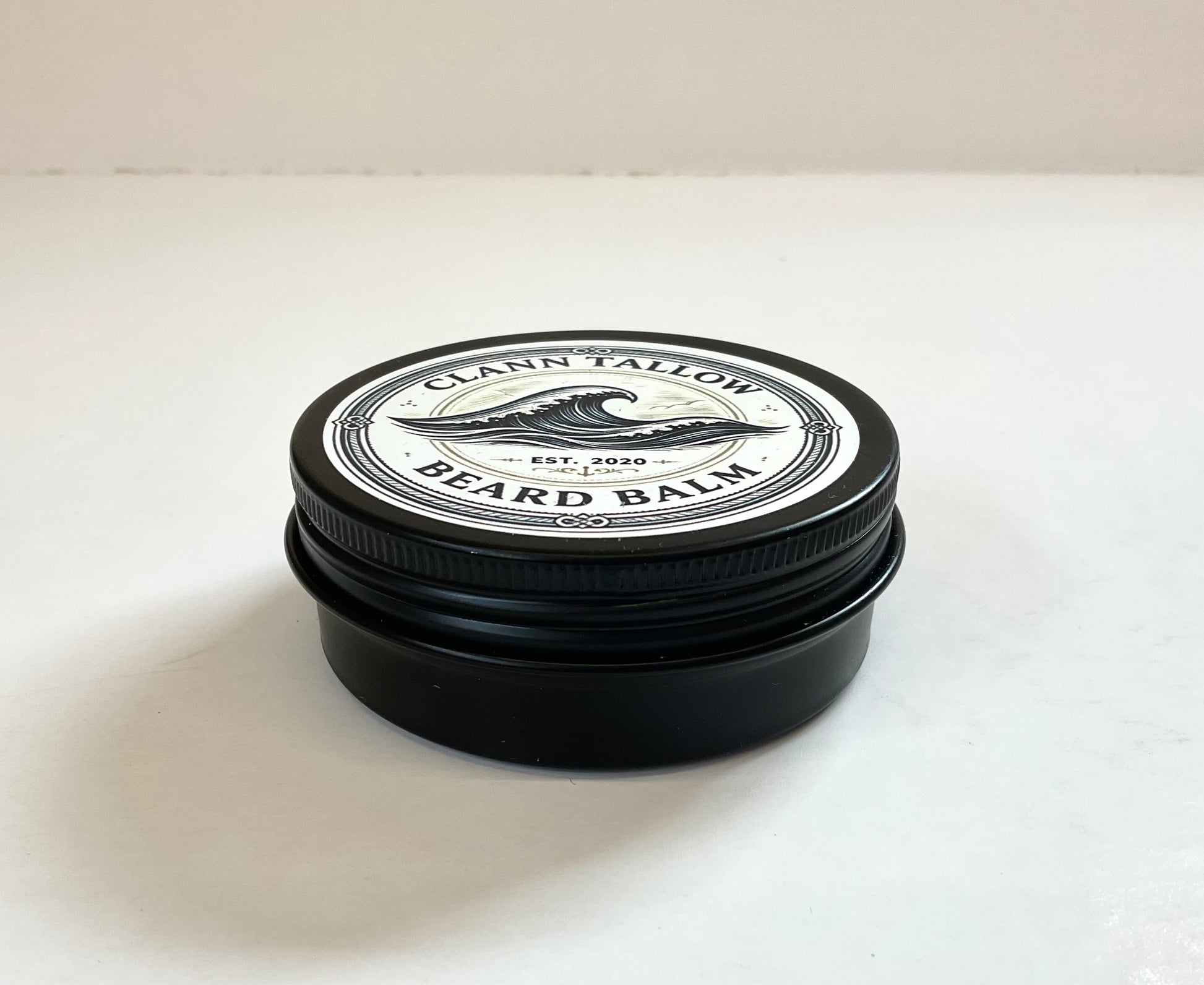 Blackbeard balm clann tallow  jar of beard balm with a white label on a white background