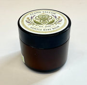 Black jar of Clann Tallow Gentle Baby Balm on a white background