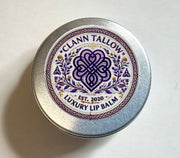 Clann Tallow luxury lip balm container with decorative label on a white background