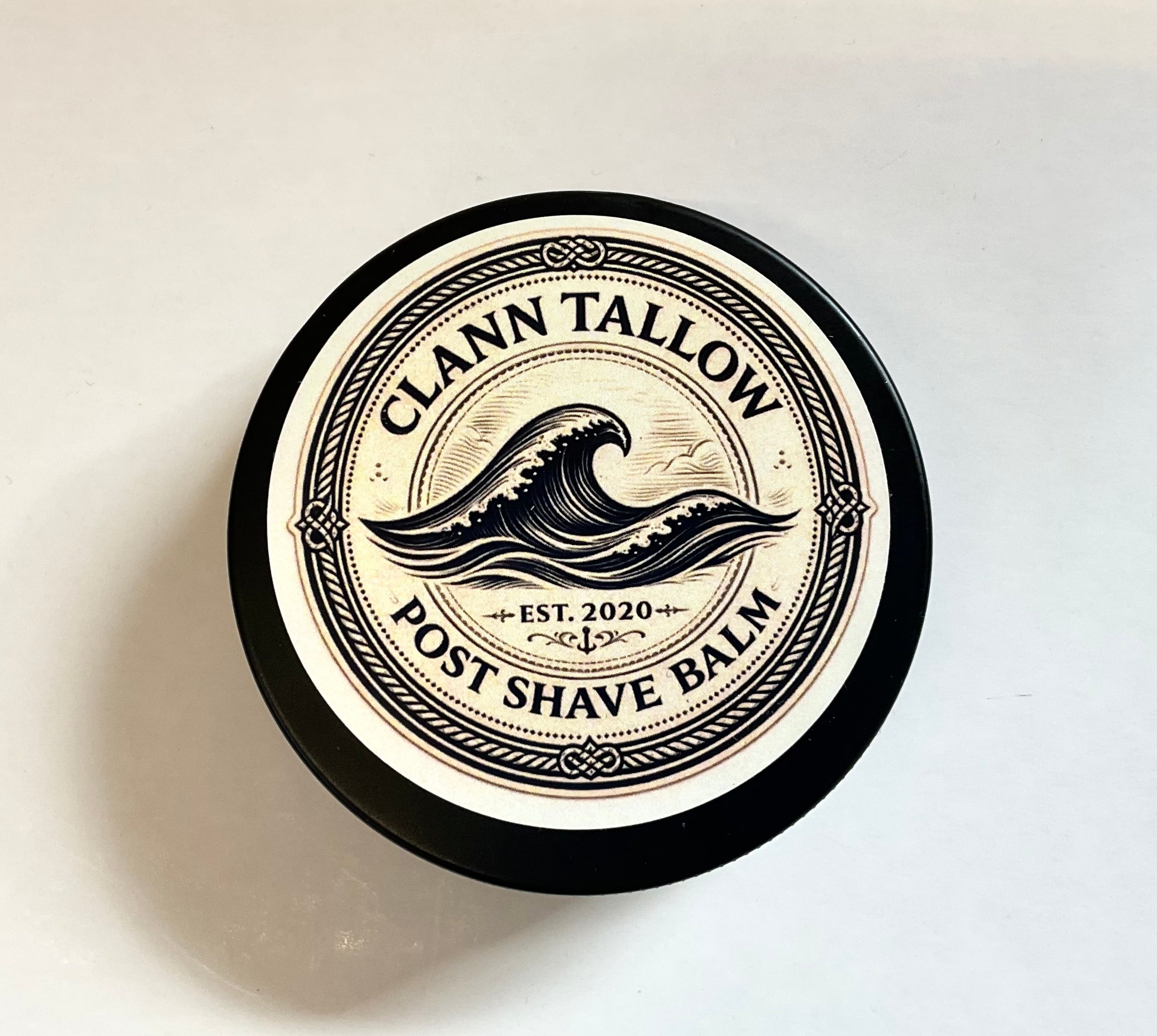 Clann Tallow post shave balm container on a light background