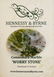 Worry stone with Connemara Marble on a Hennessy & Byrne branded card.