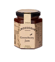 A hexagonal glass jar of Crossogue Preserves Gooseberry Jam with a black lid and a beige paper label, shown on a plain white background.