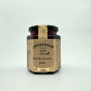 A jar of Crossogue Blackcurrant Jam with a label that includes the brand name, product name, and an award badge.