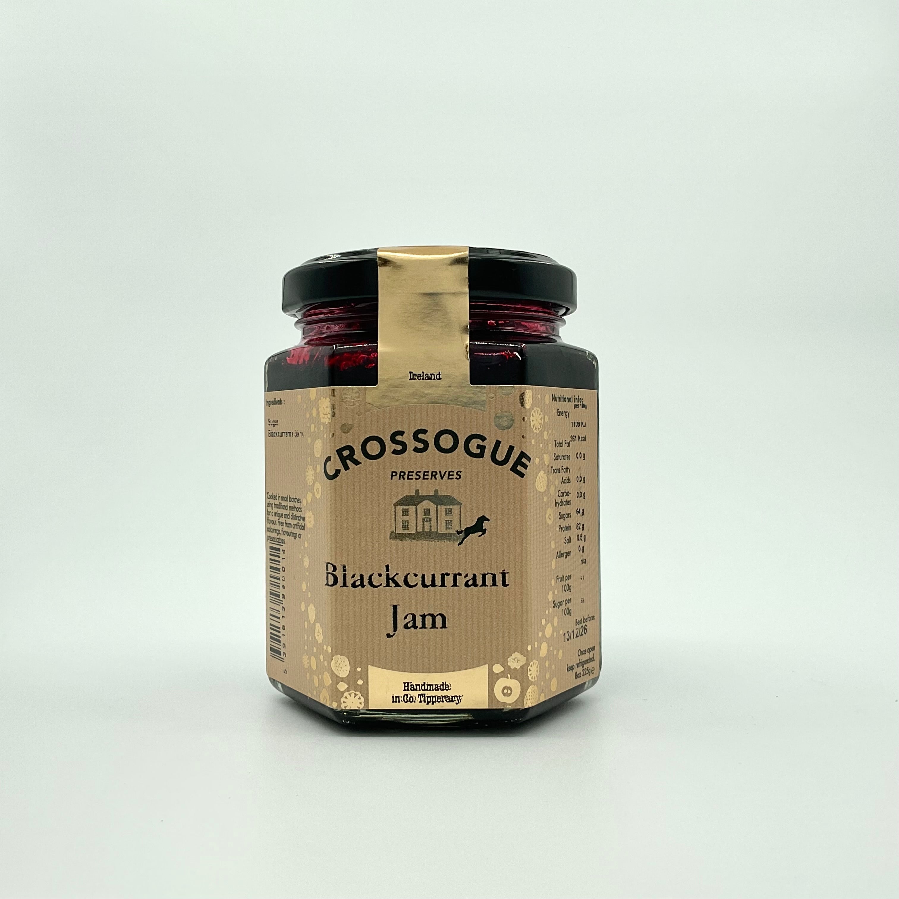 A jar of Crossogue Blackcurrant Jam with a label that includes the brand name, product name, and an award badge.