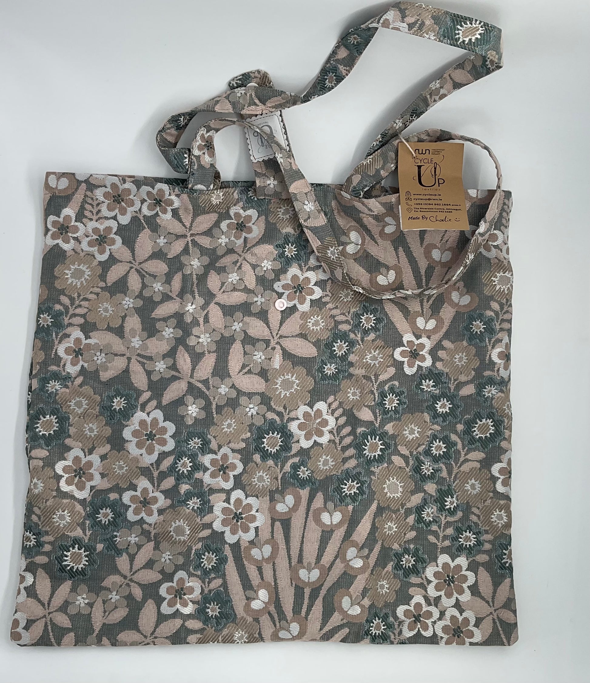 a brown beige green floral tote bag