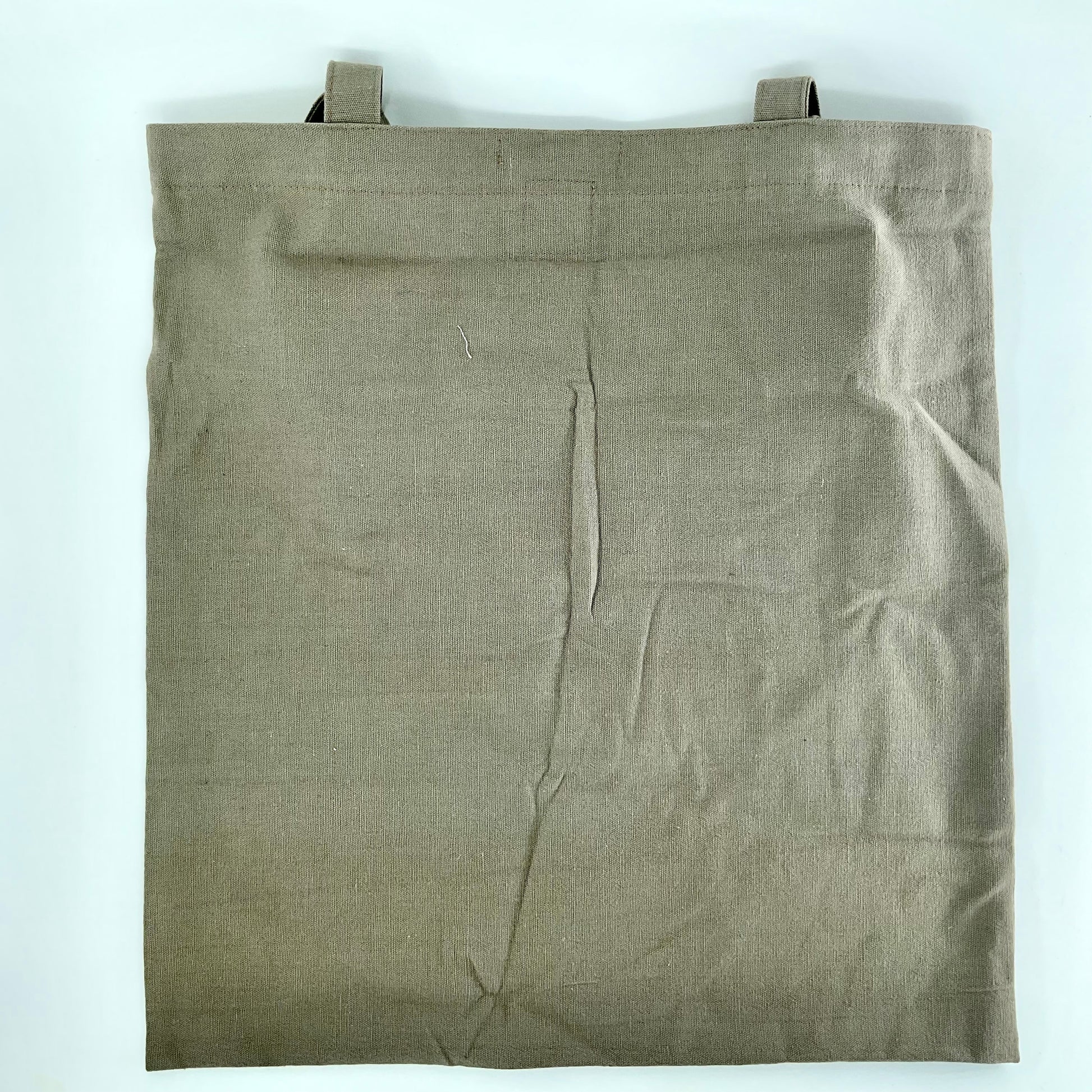 Brown fabric bag with straps on a white background