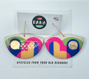 A pair of Dana Jewellery Lola Earrings in boat shape with colors pink, yellow, green, blue, displayed on a white background with the brand name 'DANA' above and the earrings number '46' marked below.