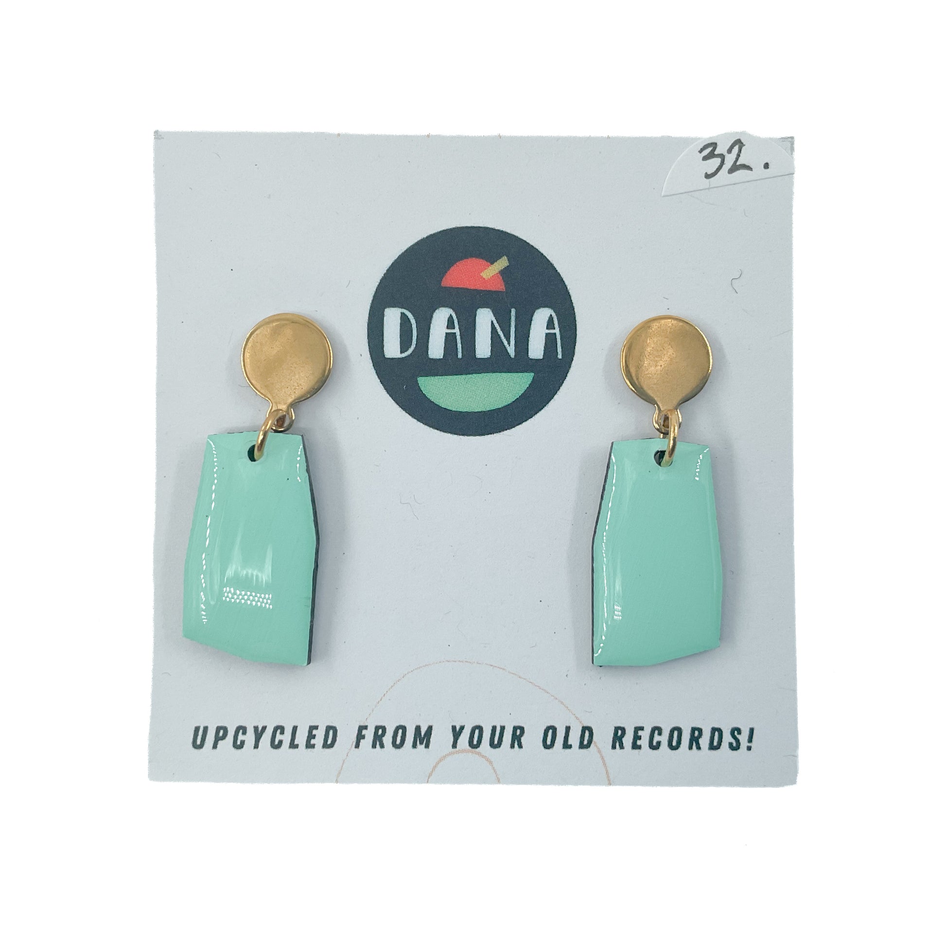 Light green drop earrings with gold loop and disc stud on white card background