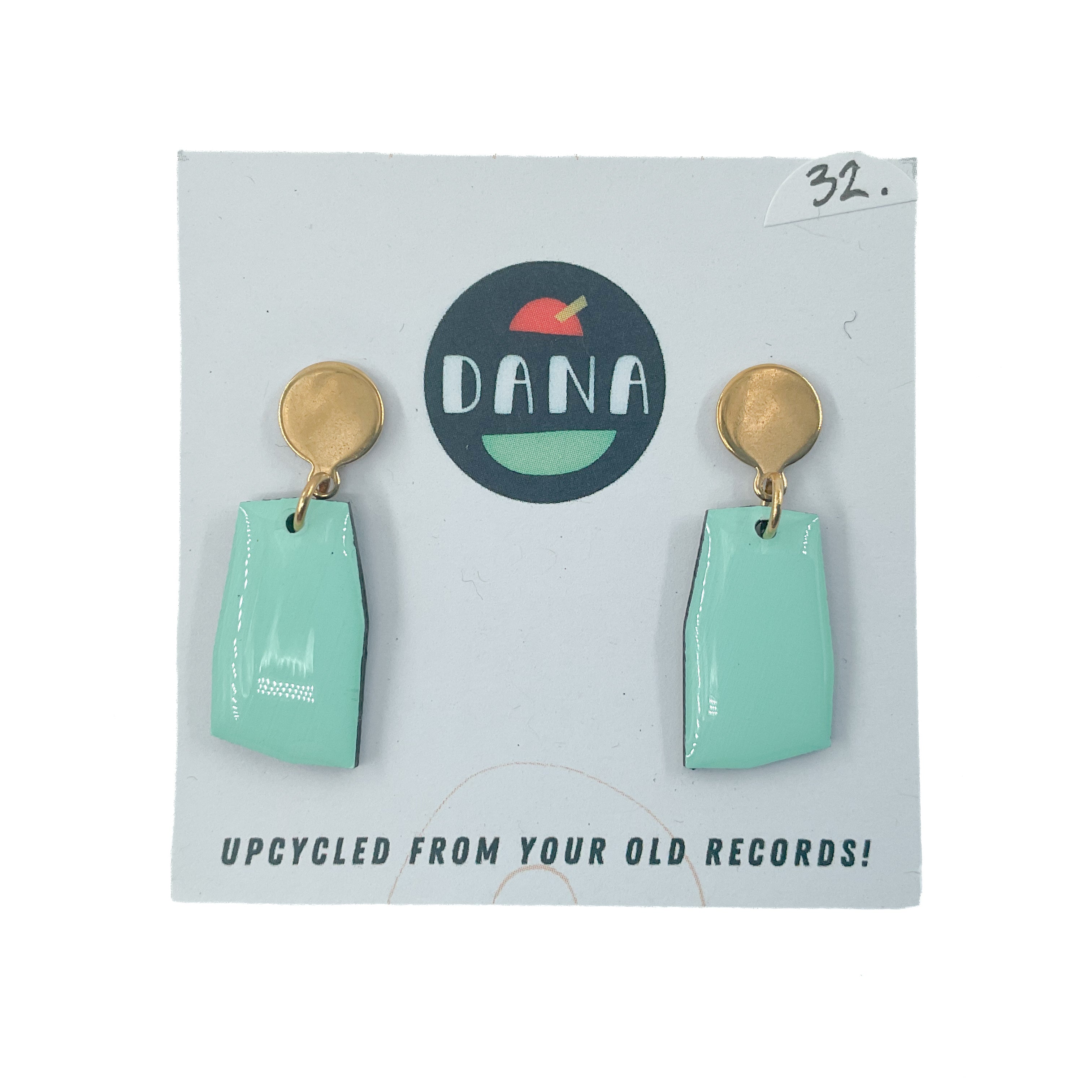 Light green drop earrings with gold loop and disc stud on white card background