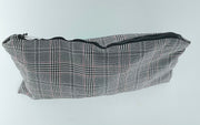 Gray plaid pouch with a zipper on a light gray background