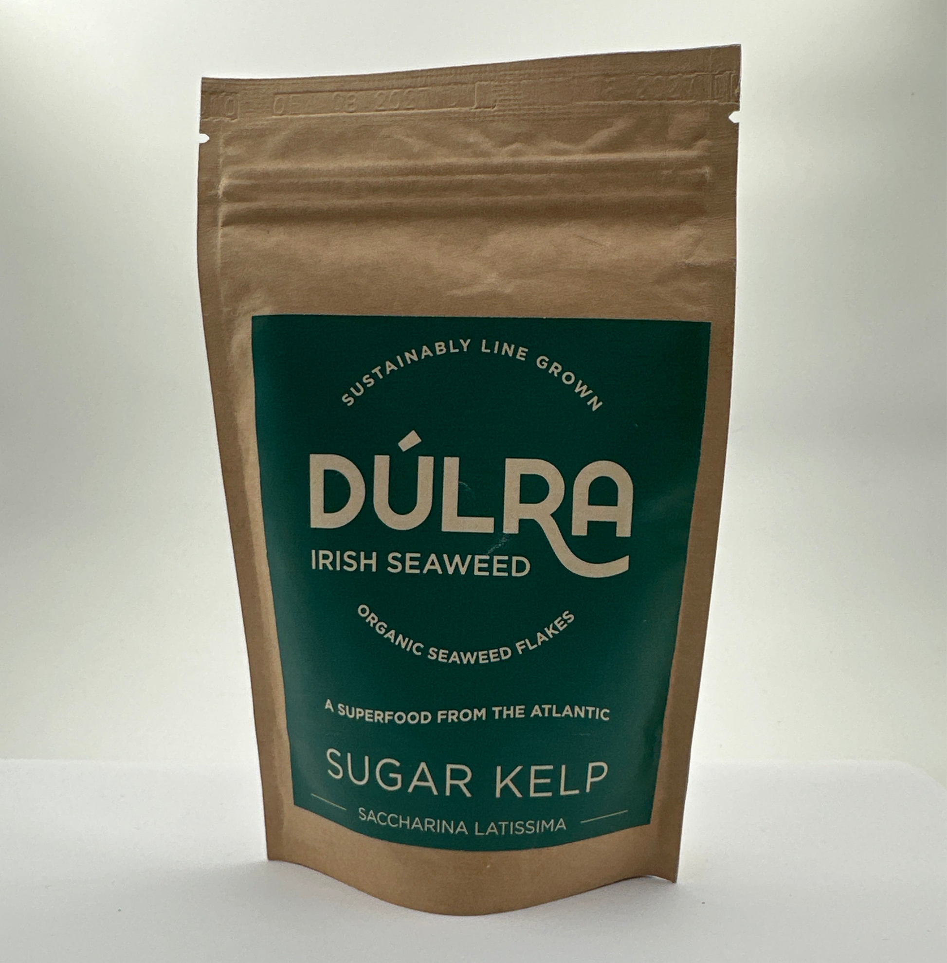 Packaged Dulra Irish Seaweed, specifically Sugar Kelp, in a brown bag with a green label displaying the product name and organic certification.