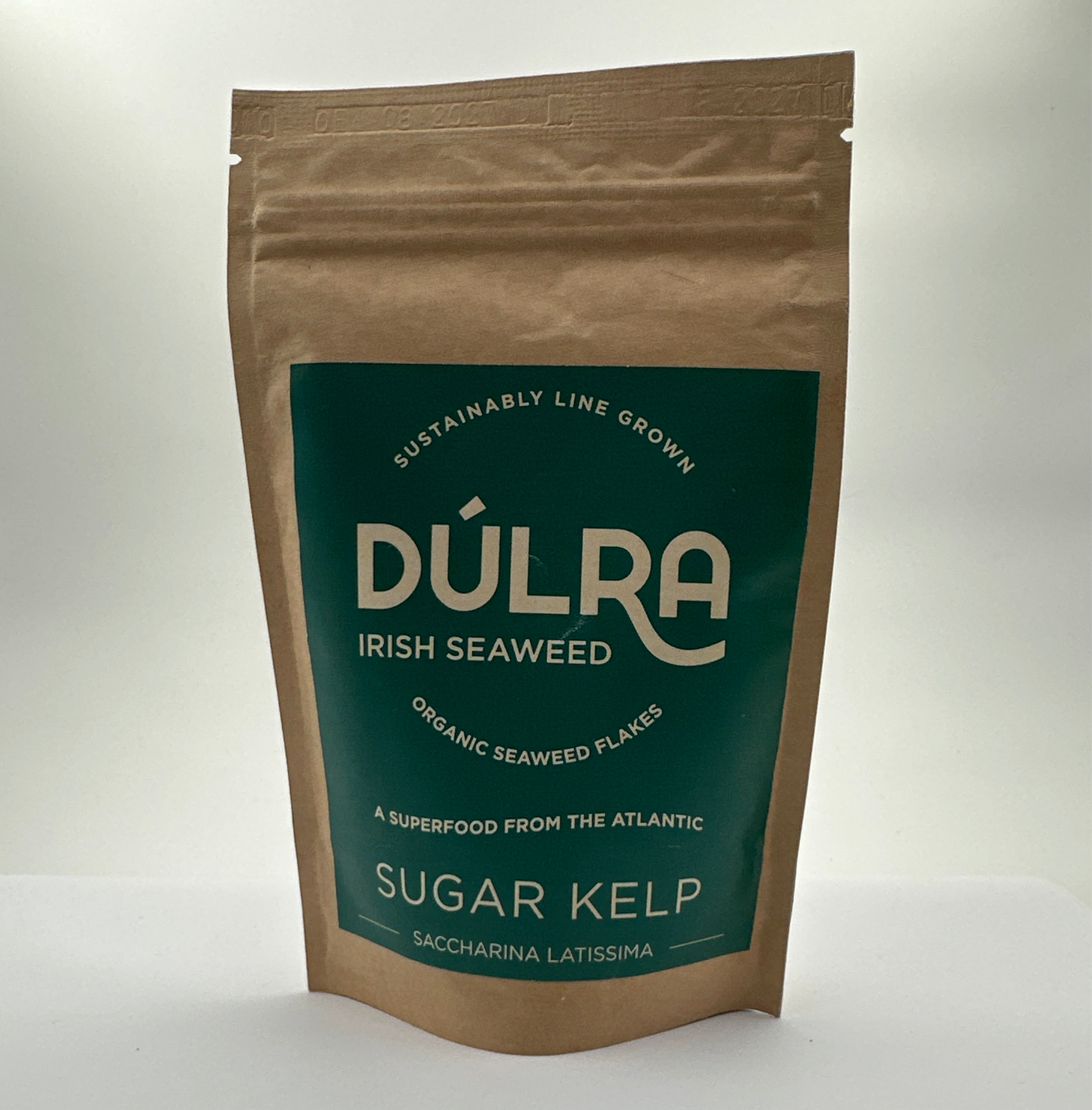 Packaged Dulra Irish Seaweed, specifically Sugar Kelp, in a brown bag with a green label displaying the product name and organic certification.