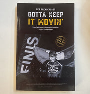 Book cover with text 'Gotta Keep It Movin'' and featuring athlete Ger Prendergast holding an Irish flag at the finish line of a race