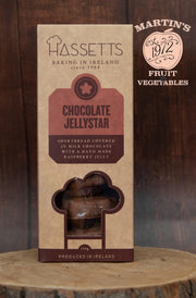 Hassetts Chocolate Jellystar packaging on a wooden surface with a blurred background