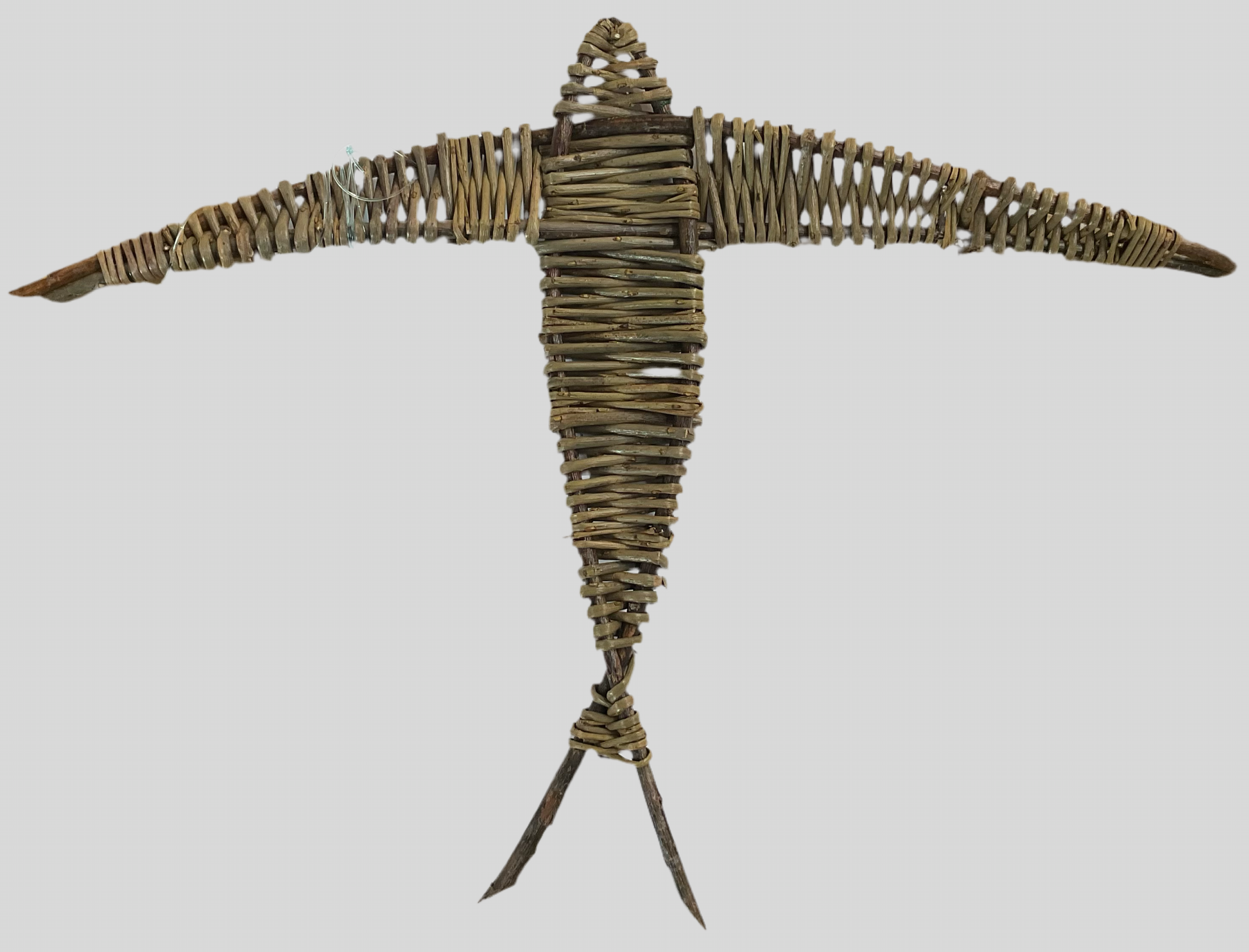 A willow swallow sculpture with an open wingspan, made from organically grown willow, soaked in water and hand-sorted for color, shape, and size.