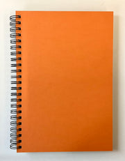 Orange spiral-bound notebook on a white background