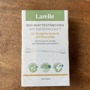 green and white paper box of cotton buds