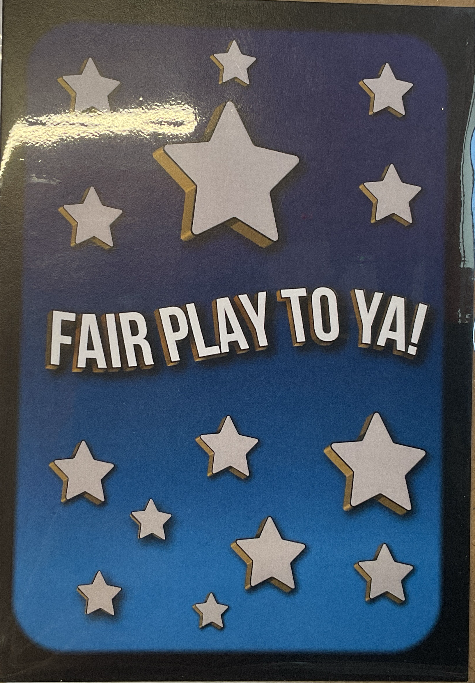 A greeting card with a blue background featuring white and gold stars, and the text 'FAIR PLAY TO YA!' in bold letters.