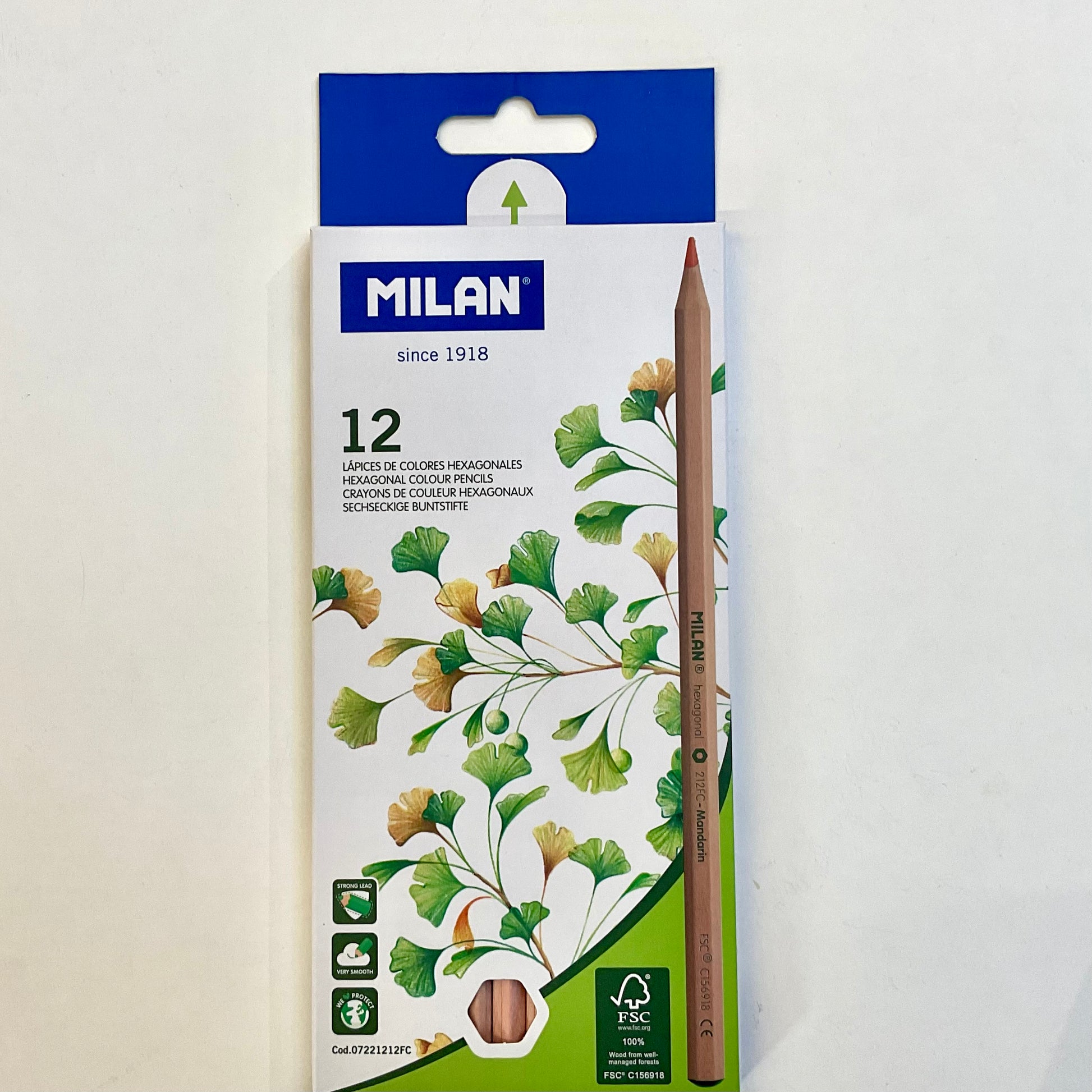 Pack of Milan colored pencils with a blue and white box on a light gray background