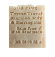 Zero-waste thyme travel shampoo, body, and shaving bar on a white background