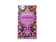 Packaging of Pukka Morning Berry tea with illustrations of berries and leaves on a purple background.