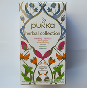 Packaging of Pukka Herbal Collection featuring various herbal tea blends, with colorful botanical design and 'organic' label.