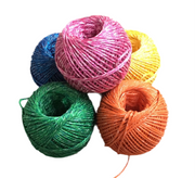 Five colorful balls of yarn on a white background
