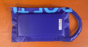 Blue plastic bag with a brand logo on a wooden surface