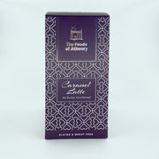 A purple rectangular box of 'The Foods of Athenry' Caramel Latte All Butter Shortbread, featuring a white geometric heart pattern and white text, set against a plain white background.