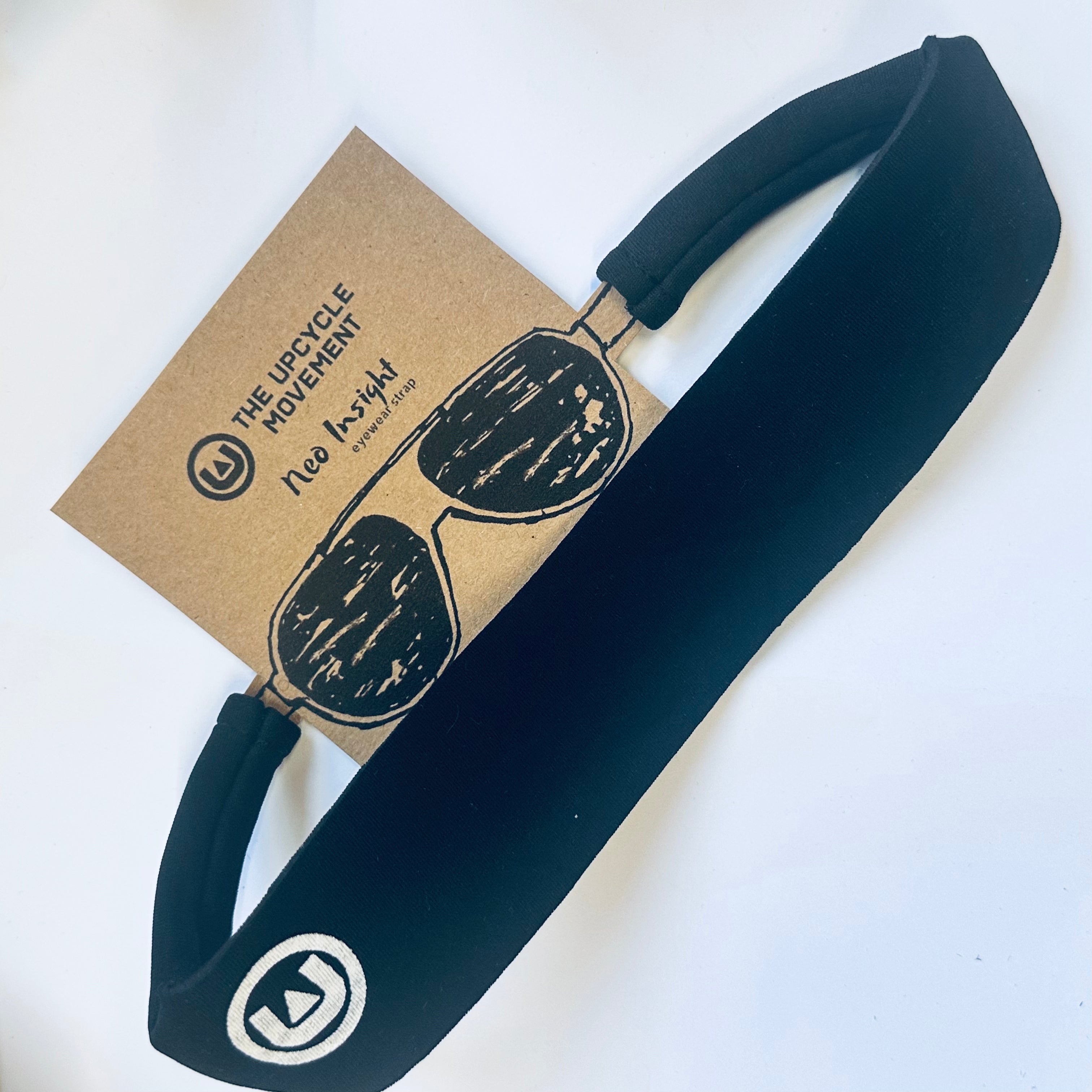 Blue glasses strap attached to product tag on white background 
