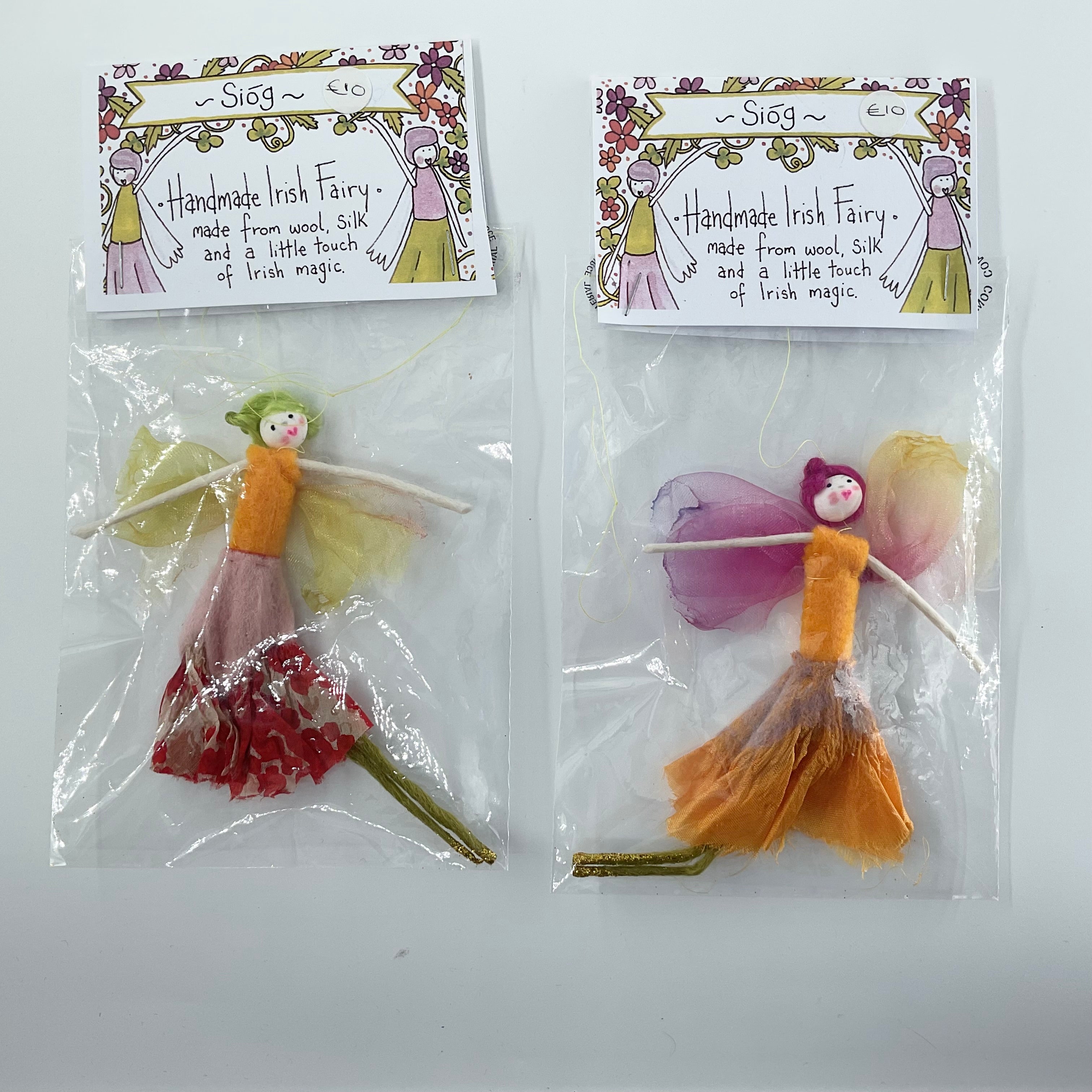 Two handmade Irish fairies from Three Sisters in clear packaging with labels on a white background