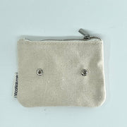 A beige eco soap bag with a zipper, made from recycled cotton with the brand name 'VICO' visible on the fabric.