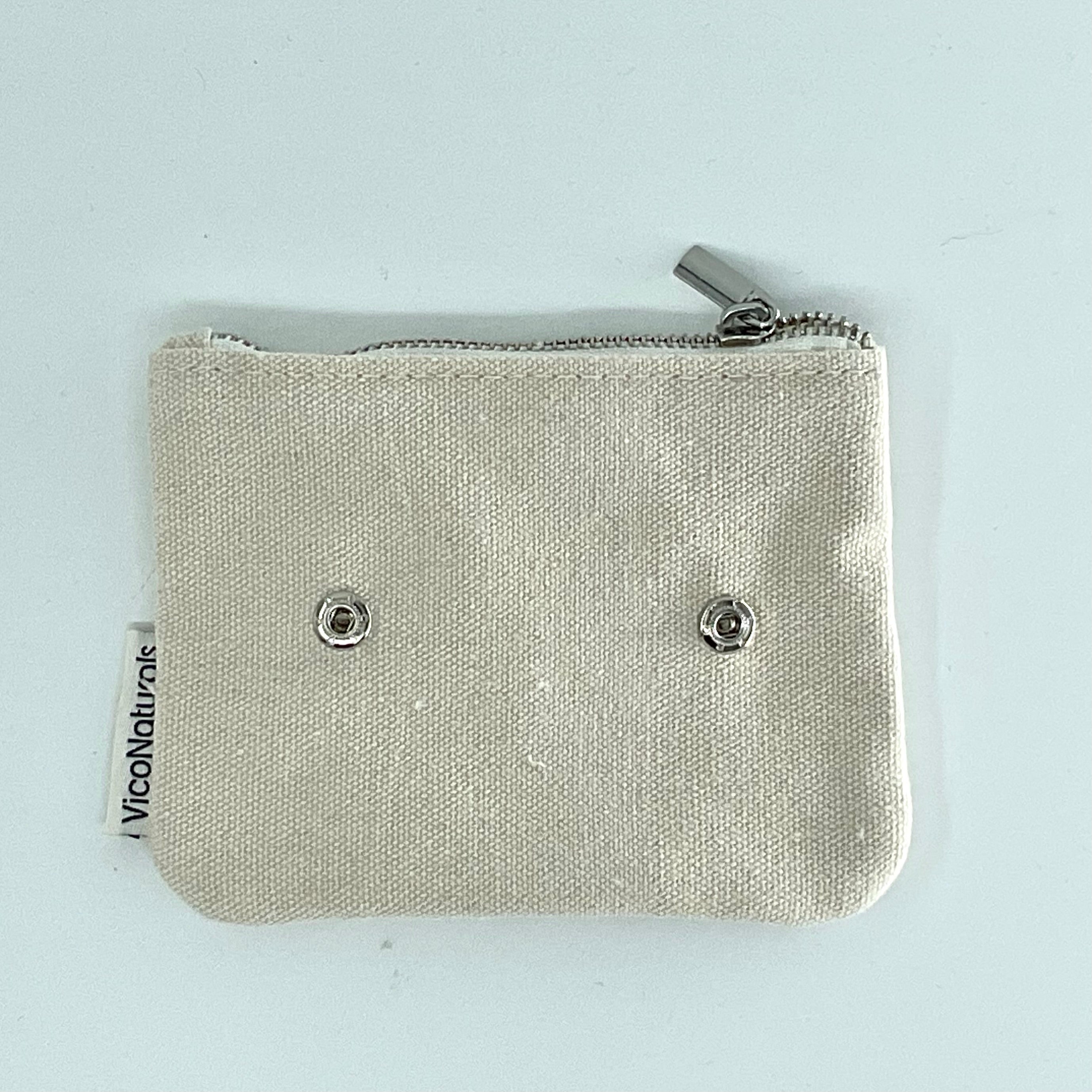 A beige eco soap bag with a zipper, made from recycled cotton with the brand name 'VICO' visible on the fabric.