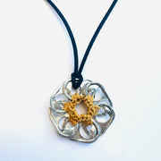 necklace made from repurposed can pulls with yellow thread