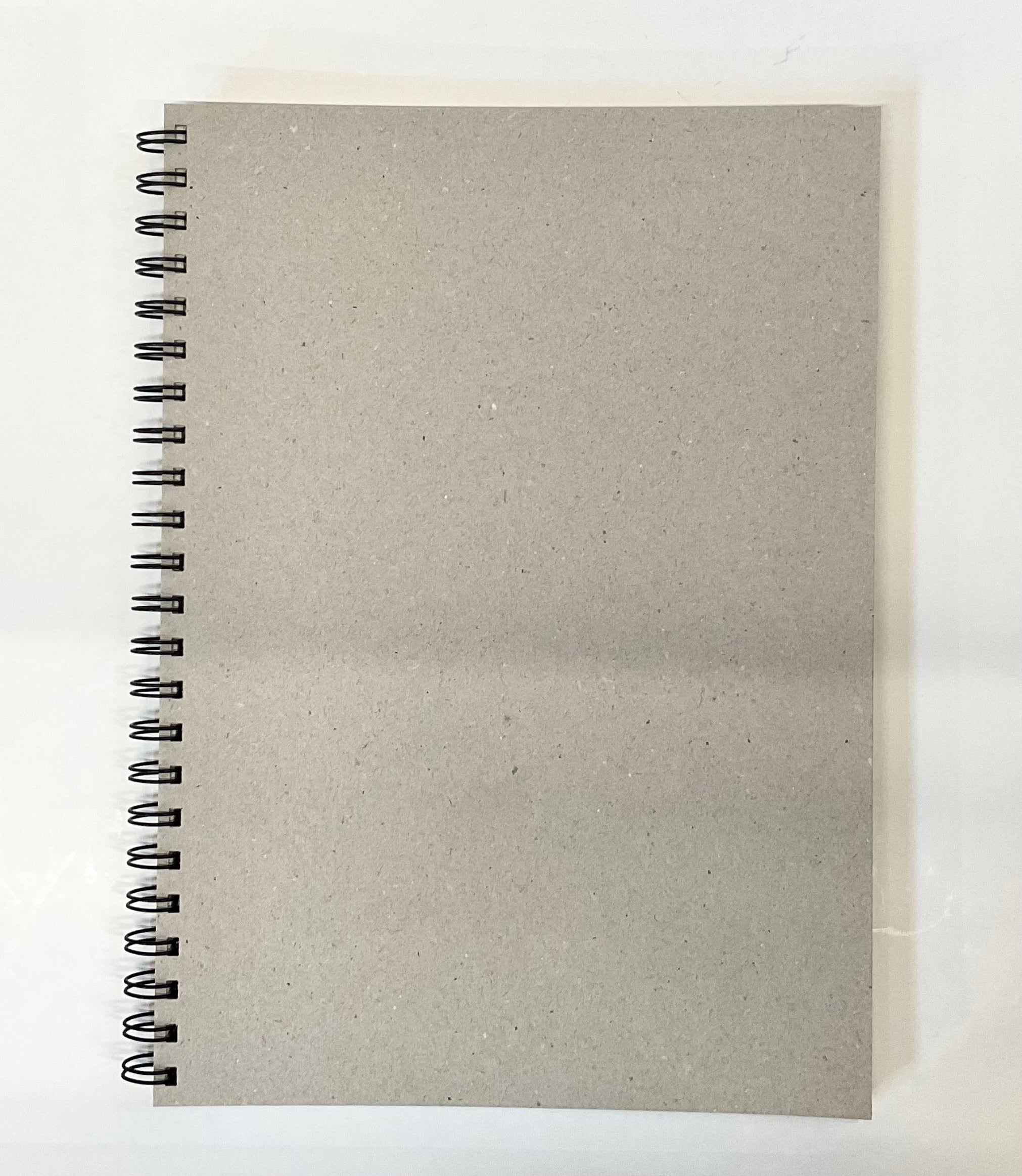 Spiral-bound notebook with textured cover on a white background