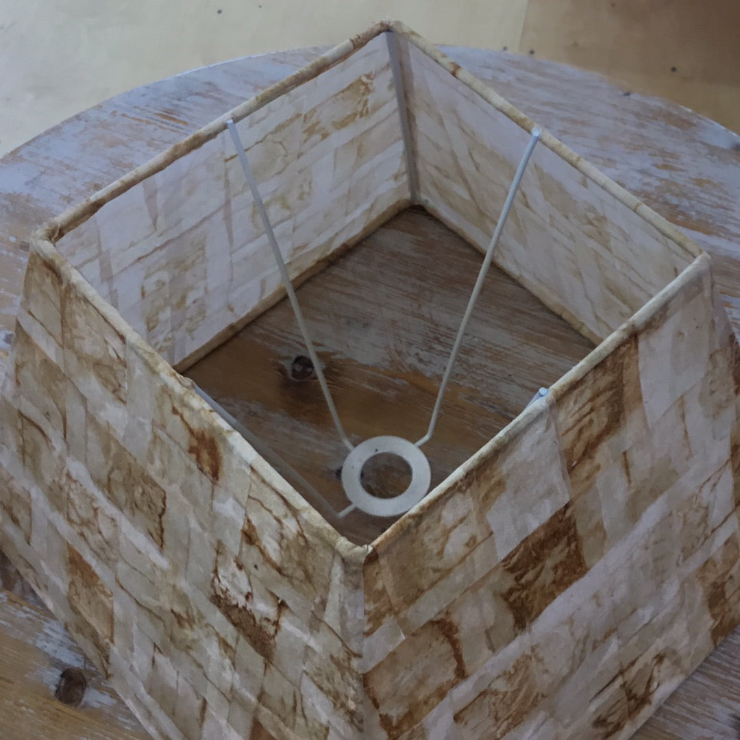 top of a lampshade made from tea bags