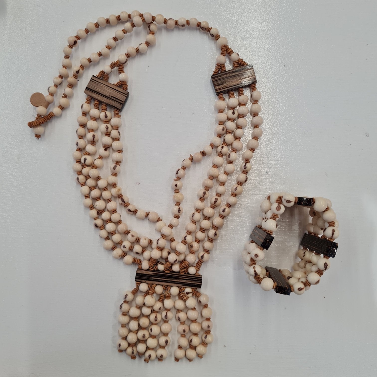 3 strand Necklace and braclet made of cream acai seeds
