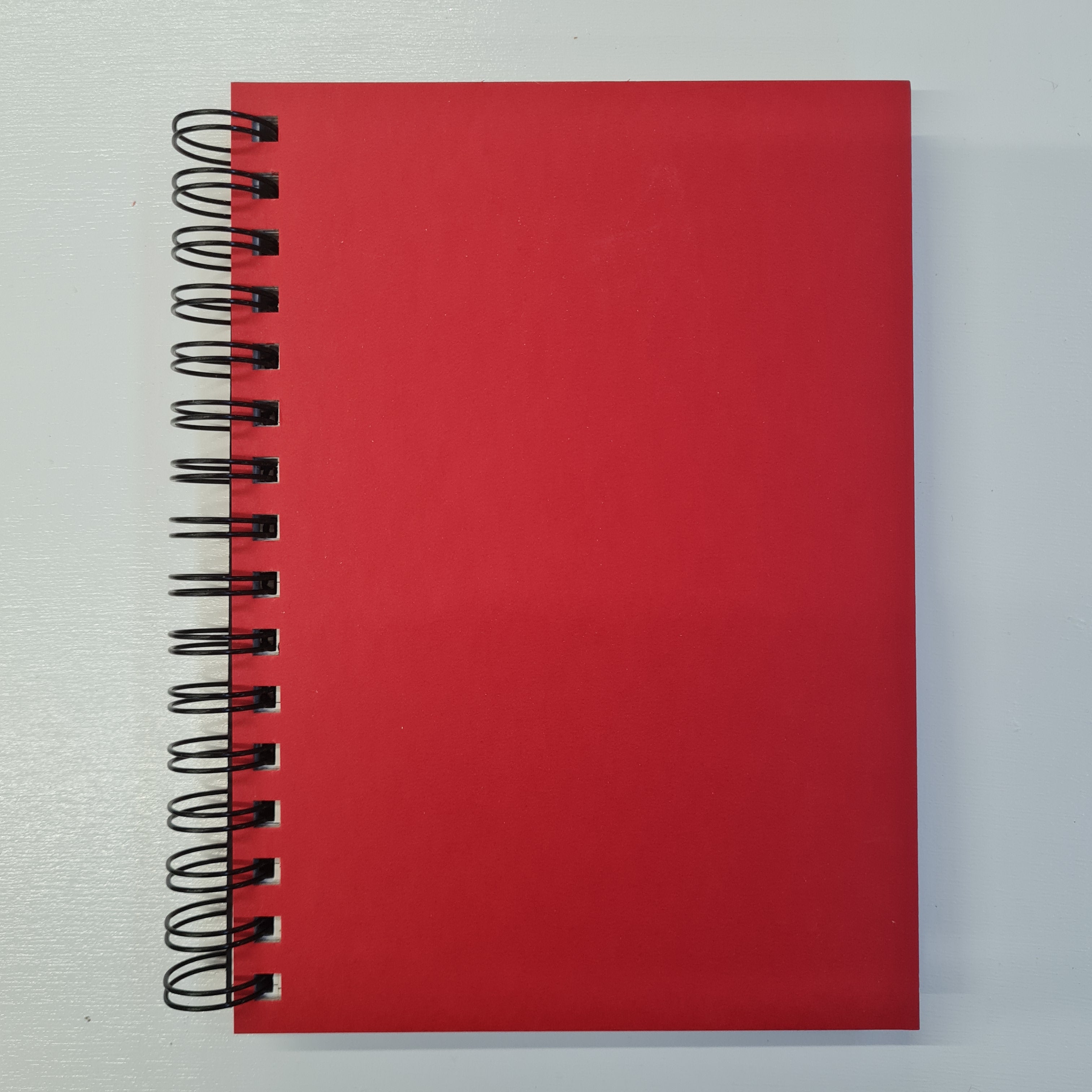 red spiral notebook